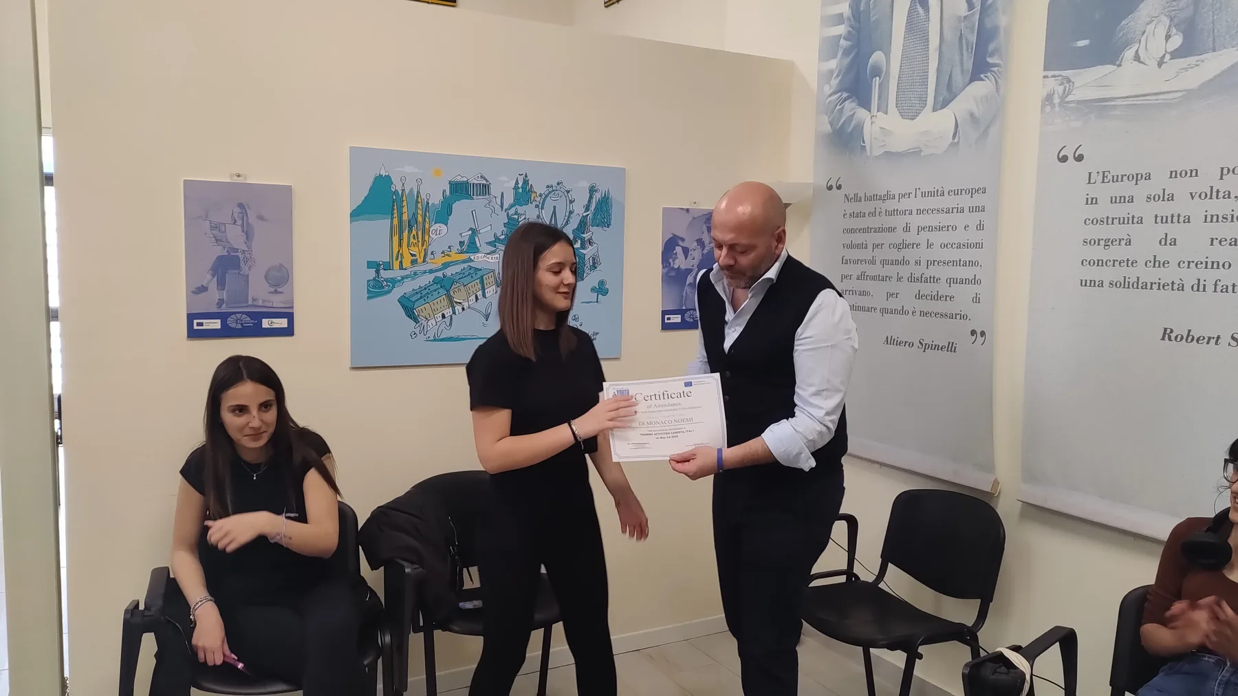 A participant receiving a certificate of attendance at the close of the Invest in Youth training in Caserta.